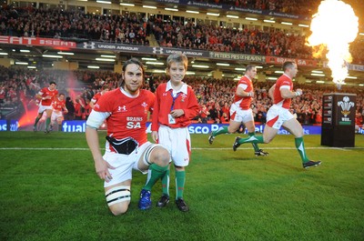 21.11.09 - Wales v Argentina - Invesco Perpetual Series 2009 - Wales captain Ryan Jones leads his team out with mascot Jonathan Hansford. 