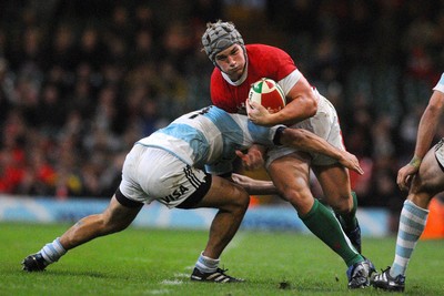 21.11.09 - Invesco Perpetual International Rugby, Wales v Argentina Wales' Jonathan Davies is tackled by Argentina's Lucas Borges 
