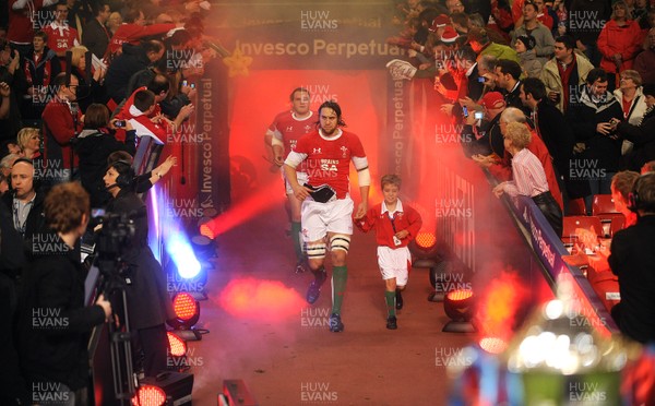 21.11.09 - Wales v Argentina - Invesco Perpetual Series 2009 - Wales captain Ryan Jones leads his team out with mascot Jonathan Hansford. 