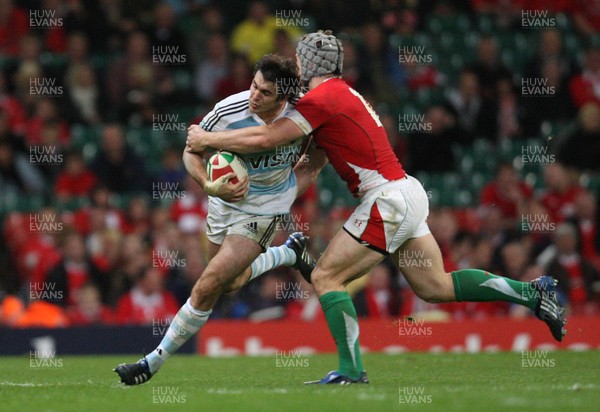 21.11.09... Wales v Argentina, Invesco Perpetual Series 2009 -  Argentina's Gonzalo Tiesi is tackled by Wales' Jonathan Davies 