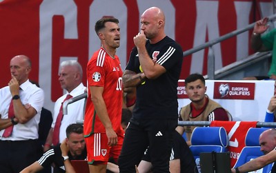 160623 - Wales v Armenia - UEFA European Championship Qualifers - Aaron Ramsey of Wales walks past Wales manager Rob Page after being substituted