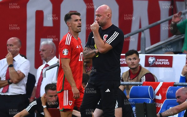 160623 - Wales v Armenia - UEFA European Championship Qualifers - Aaron Ramsey of Wales walks past Wales manager Rob Page after being substituted