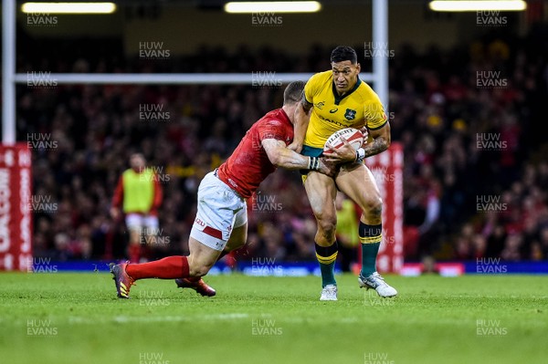 101118 - Wales v Australia, Under Armour Series - Israel Folau of Australia is brought to the floor