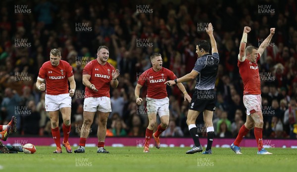 101118 - Wales v Australia - Under Armour Series 2018 - Dan Biggar, Dillon Lewis and Gareth Anscombe and Hadleigh Parkes of Wales celebrate the victory at full time
