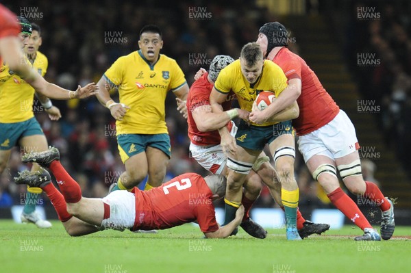 101118 - Wales v Australia - Under Armour Series 2018 - Jack Dempsey of Australia  is tackled by Ken Owens of Wales and Adam Beard of Wales and Dan Lydiate of Wales 