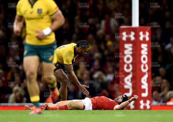 101118 - Wales v Australia - Under Armour Series -  Leigh Halfpenny of Wales is tackled off the ball by Samu Kerevi of Australia