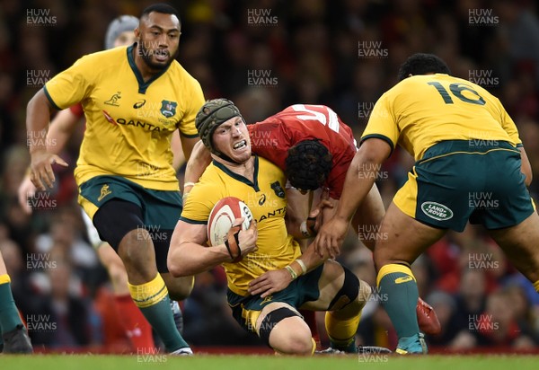 101118 - Wales v Australia - Under Armour Series - David Pocock of Australia is tackled by Leigh Halfpenny of Wales