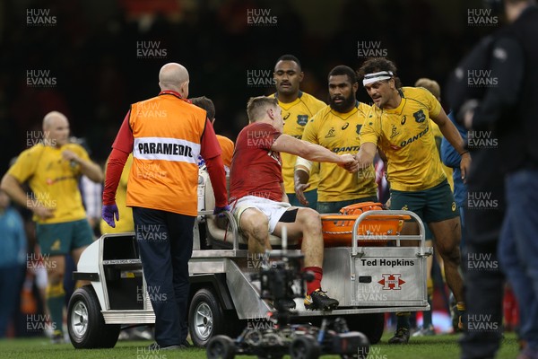 111117 - Wales v Australia - Under Armour Series 2017 - Dejected Jonathan Davies of Wales going off injured at full time shakes the Australian players hands