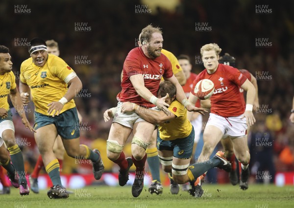 111117 - Wales v Australia, Under Armour Series 2017 - Alun Wyn Jones of Wales passes the ball as he is tackled by Ben McCalman of Australia