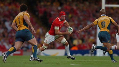14.09.07 - Wales v Australia - Rugby World Cup 2007 -  Wales' Jonathan Thomas takes on George Gregan 
