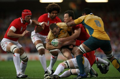 15.09.07  Wales v Australia... Australia's Chris Latham is tackled by Mark Jones. 