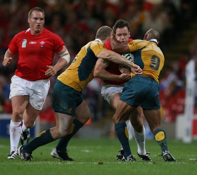15.09.07  Wales v Australia... Wales Mark Jones is tackled by Stephen Moore and George Gregan. 
