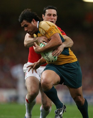 15.09.07  Wales v Australia... Wales Stephen Jones tackles  George Smith. 
