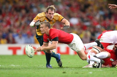15.09.07 -Wales v Australia, RWC 2007 -  Wales' Dwayne Peel feeds the ball out as Rocky Elsom closes in 