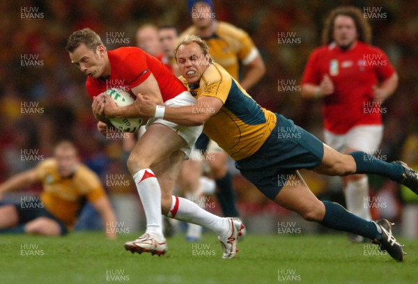 14.09.07 - Wales v Australia - Rugby World Cup 2007 -  Wales' Kevin Morgan is tackled by Phil Waugh 