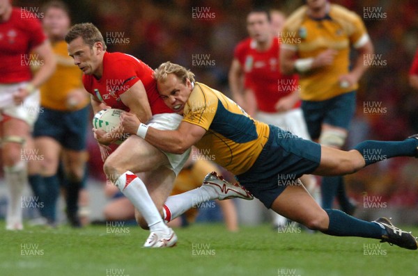 14.09.07 - Wales v Australia - Rugby World Cup 2007 -  Wales' Kevin Morgan is tackled by Phil Waugh 
