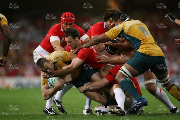 15.09.07  Wales v Australia... Australia's Chris Latham is tackled by Mark Jones. 