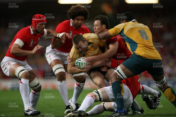 15.09.07  Wales v Australia... Australia's Chris Latham is tackled by Mark Jones. 