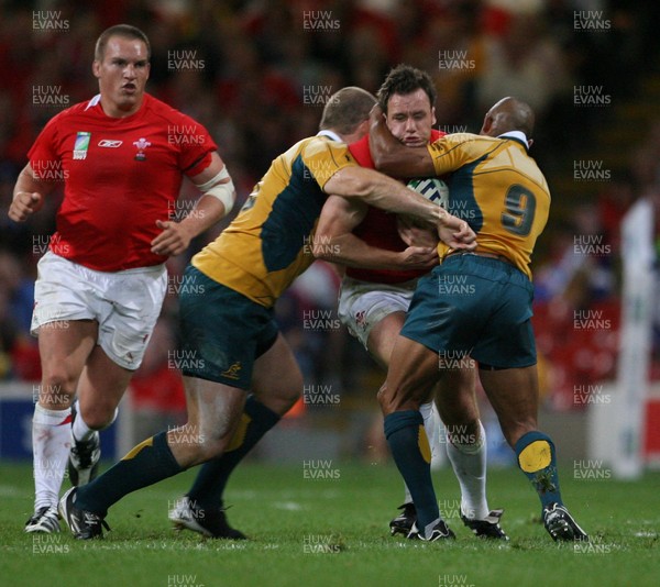 15.09.07  Wales v Australia... Wales Mark Jones is tackled by Stephen Moore and George Gregan. 