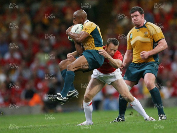 15.09.07  Wales v Australia... Wales Kevin Morgan tackles George Gregan. 