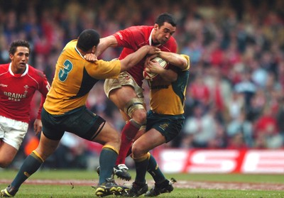 04.11.06  Wales v Australia.  Wales Jonathan Thomas is tackled by Rodney Blake and Phil Waugh 