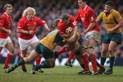 04.11.06  Wales v Australia, Invesco Perpetual Series 2006 Wales' Kevin Morgan is tackled by Brendan Cannon 