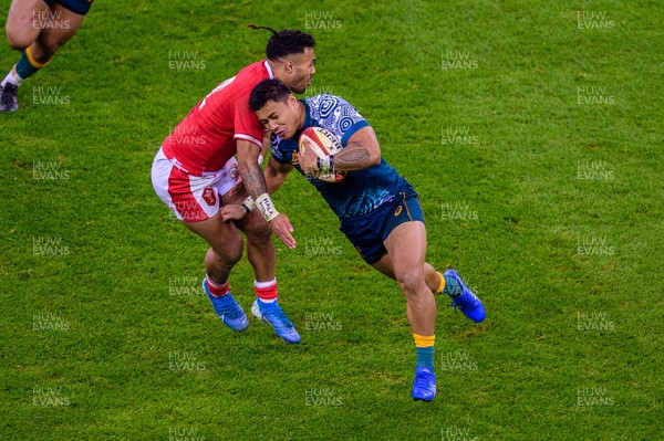 201121 - Wales v Australia - Autumn Nations Series - Len Ikitau of Australia is tackled by Willis Halaholo of Wales 