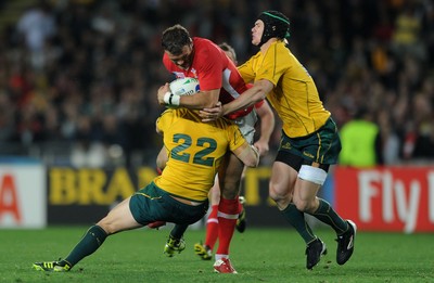 21.10.11 - Wales v Australia - Rugby World Cup Bronze Final - Jamie Roberts of Wales is tackled by Rob Horne and Berrick Barnes of Australia. 