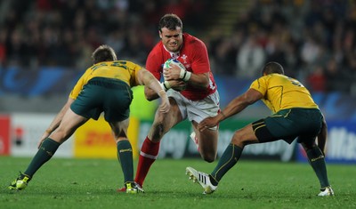 21.10.11 - Wales v Australia - Rugby World Cup Bronze Final - Jamie Roberts of Wales takes on Rob Horne and Will Genia of Australia. 