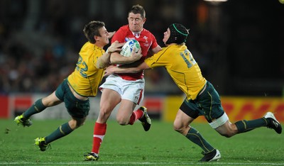 21.10.11 - Wales v Australia - Rugby World Cup Bronze Final - Shane Williams of Wales takes on Rob Horne and Berrick Barnes of Australia. 