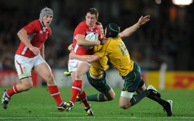21.10.11 - Wales v Australia - Rugby World Cup Bronze Final - Shane Williams of Wales takes on Rob Horne and Berrick Barnes of Australia. 