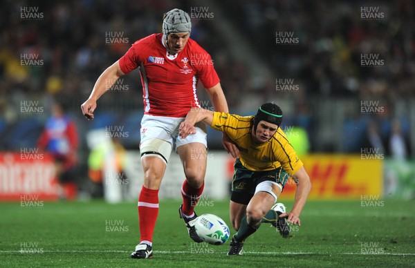 21.10.11 - Wales v Australia - Rugby World Cup Bronze Final - Jonathan Davies of Wales competes with Berrick Barnes of Australia. 