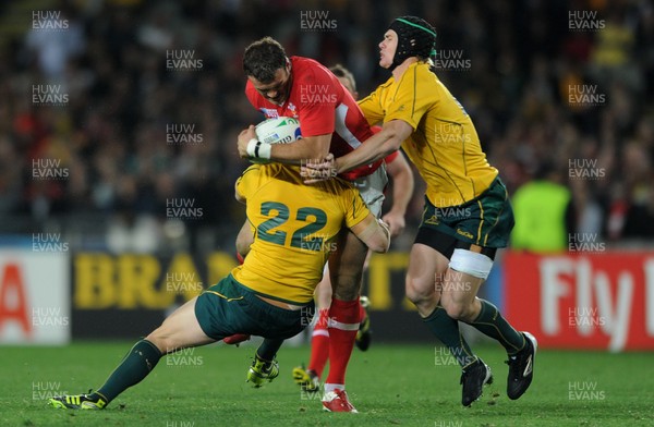 21.10.11 - Wales v Australia - Rugby World Cup Bronze Final - Jamie Roberts of Wales is tackled by Rob Horne and Berrick Barnes of Australia. 