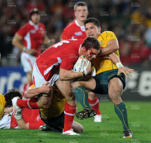 21.10.11 - Wales v Australia - Rugby World Cup Bronze Final - George North of Wales is stopped by Anthony Faingaa of Australia. 