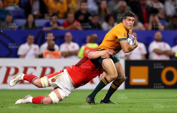 240923 - Wales v Australia - Rugby World Cup France 2023 - Pool C -  Ben Donaldson of Australia tackled by Jac Morgan of Wales