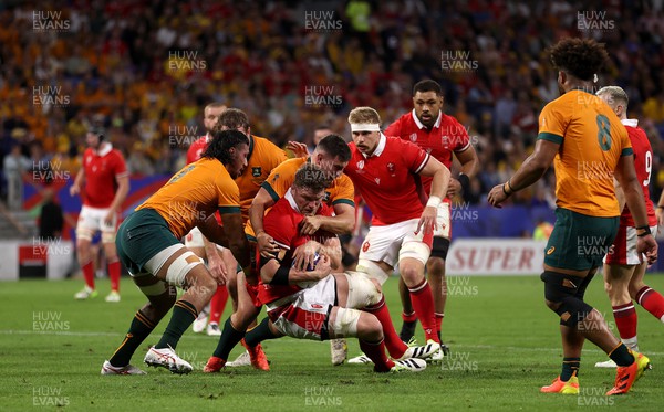 240923 - Wales v Australia - Rugby World Cup France 2023 - Pool C -  Will Rowlands of Wales is tackled by David Porecki of Australia