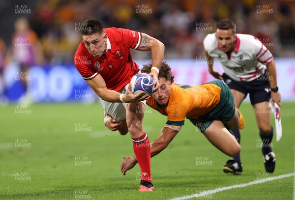 240923 - Wales v Australia - Rugby World Cup France 2023 - Pool C -  Josh Adams of Wales is tackled by Mark Nawaqanitawase of Australia