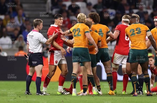 240923 - Wales v Australia - Rugby World Cup France 2023 - Pool C - Louis Rees-Zammit of Wales confronts Carter Gordon of Australia 