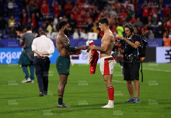 240923 - Wales v Australia - Rugby World Cup France 2023 - Pool C - Louis Rees-Zammit of Wales swaps shirts with Marika Koroibete of Australia 