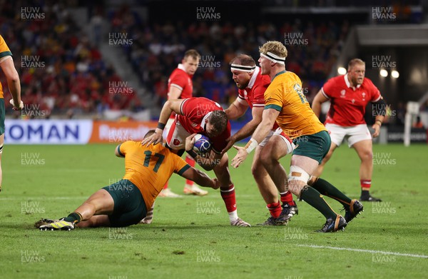 240923 - Wales v Australia - Rugby World Cup France 2023 - Pool C - Elliot Dee of Wales is tackled by Blake Schoupp of Australia 