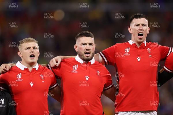 240923 - Wales v Australia - Rugby World Cup France 2023 - Pool C - Jac Morgan, Gareth Thomas and Adam Beard of Wales sing the anthem