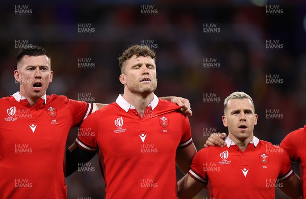240923 - Wales v Australia - Rugby World Cup France 2023 - Pool C - Adam Beard, Will Rowlands and Gareth Davies of Wales sing the anthem