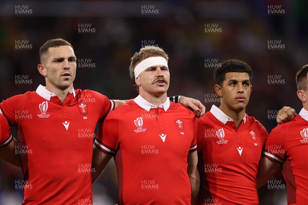 240923 - Wales v Australia - Rugby World Cup France 2023 - Pool C - George North, Aaron Wainwright and Rio Dyer of Wales sing the anthem