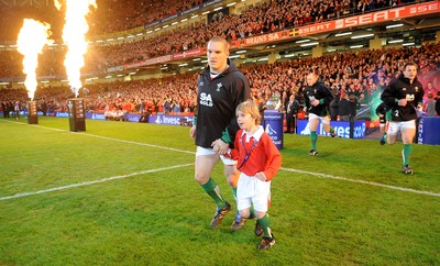 28.11.09 - Wales v Australia - Invesco Perpetual Series 2009 - Wales captain Gethin Jenkins leads out his team with mascot Tomas Bennett. 