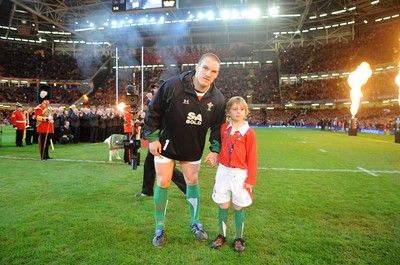 28.11.09 - Wales v Australia - Invesco Perpetual Series 2009 - Wales captain Gethin Jenkins leads out his team with mascot Tomas Bennett. 
