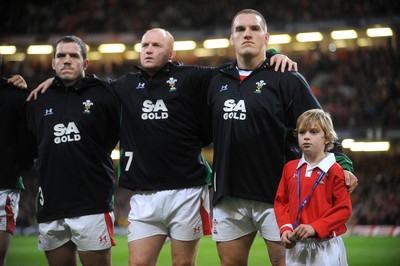 28.11.09 - Wales v Australia - Invesco Perpetual Series 2009 - Mascot Tomas Bennett lines up for the national anthems with (l-r) Paul James, Martyn Williams and Gethin Jenkins. 