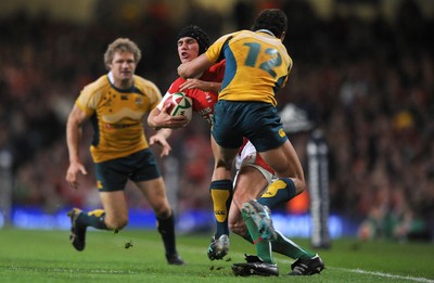 28.11.09 - Wales v Australia - Invesco Perpetual Series 2009 - Wales' Tom James is tackled by Australia's Quade Cooper. 