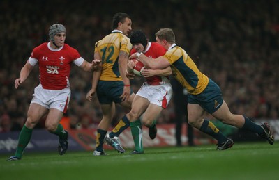 28.11.09  Wales v Australia... Wales' Leigh Halfpenny is tackled by Australia's David Pocock .. 