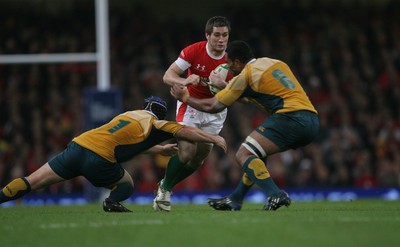 28.11.09  Wales v Australia... Wales' Andrew Bishop is tackled by Australia's Benn Robinson and Rocky Elsom. 