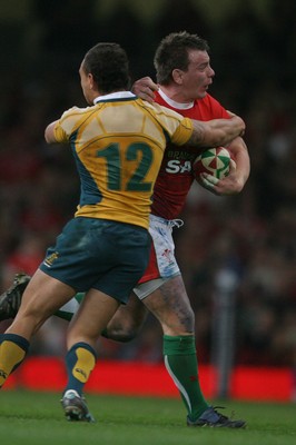 28.11.09  Wales v Australia... Wales' Matthew Rees is tackled by Australia's Quade Cooper. 